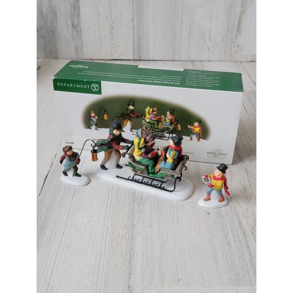 Dept 56 58396 Caroling With The Cratchit Family (Revisited) village accessory xm